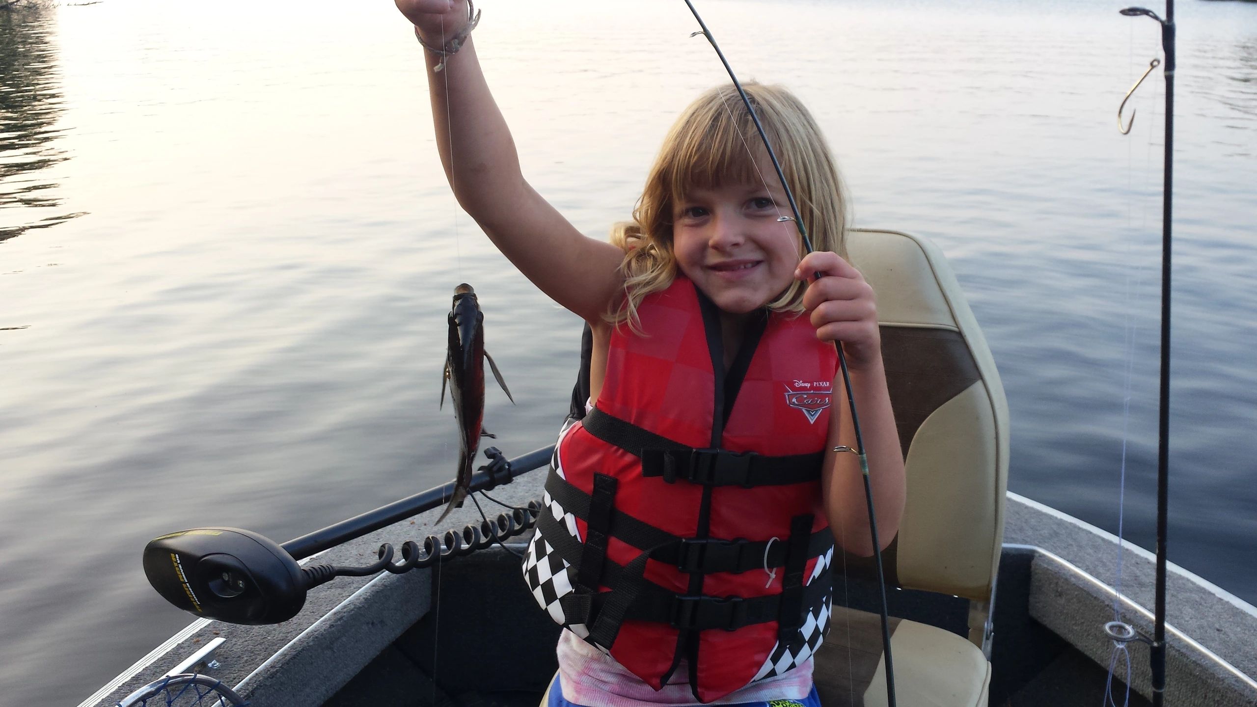 Child holding a caught fish